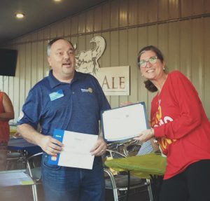 District Governor Craig presents award